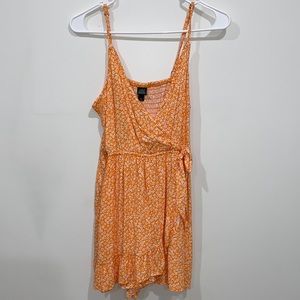 Medium orange romper with small white flowers. Brand: wild fable